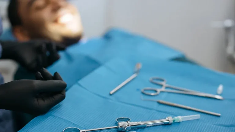Dental tools arranged neatly on a blue dental cloth. Ideal for dental care concepts.