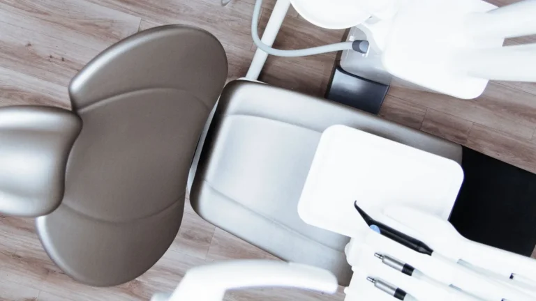 High-angle view of a modern dental chair and equipment setup in a professional clinic.
