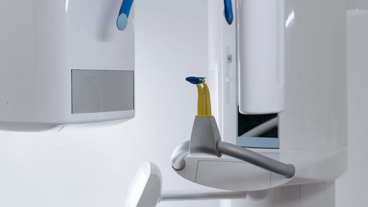 Close-up of modern dental x-ray equipment in a clinic displaying advanced odontology technology.