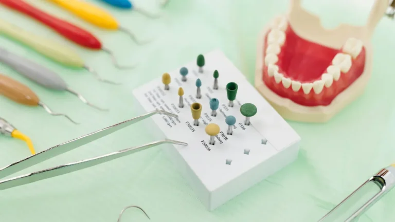 Close-up image of dental tools and model teeth for professional dentistry setup.