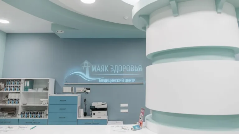 Interior of a modern clinic with teal and white design elements, emphasizing healthcare ambience.